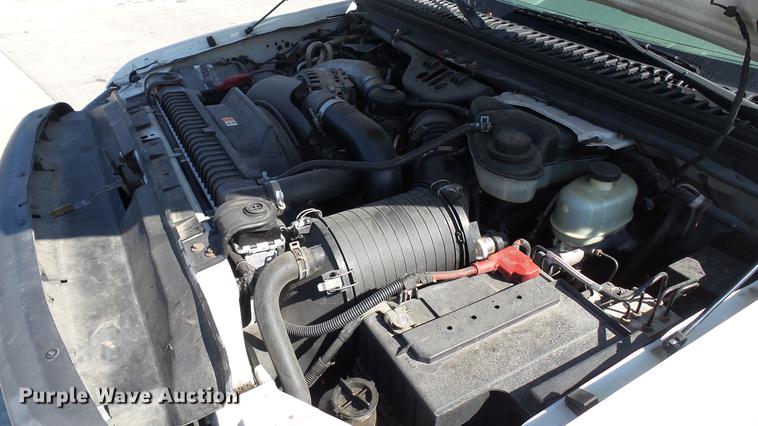 image for item DD7399 2005 Ford F550 Super Duty XL Crew Cab flatbed truck