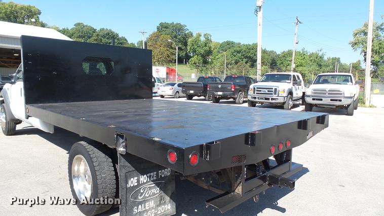 image for item DD7399 2005 Ford F550 Super Duty XL Crew Cab flatbed truck