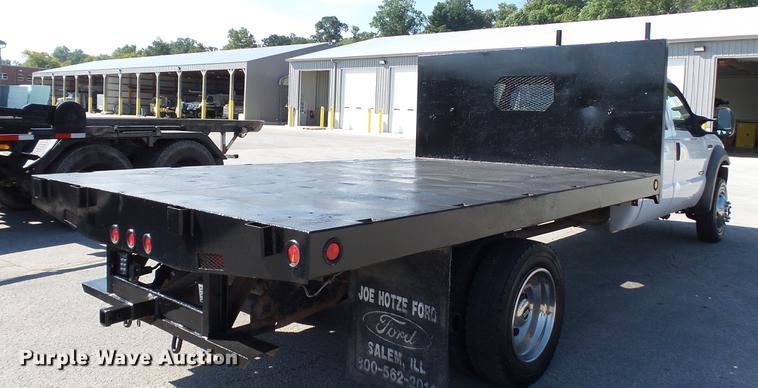 image for item DD7399 2005 Ford F550 Super Duty XL Crew Cab flatbed truck
