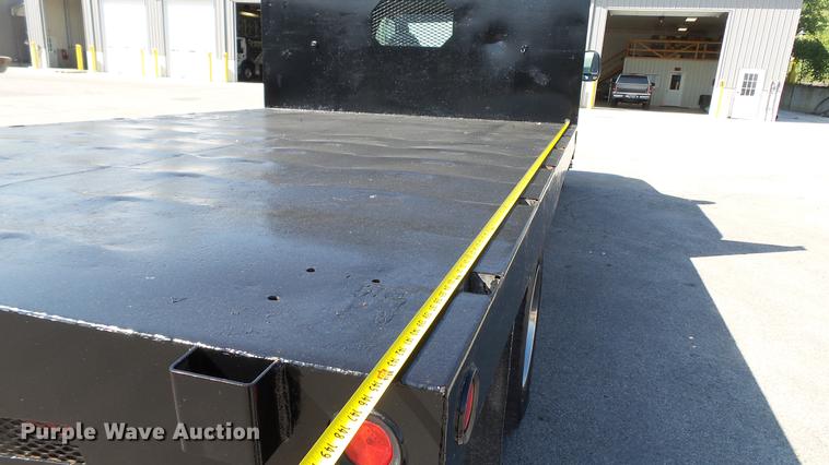 image for item DD7399 2005 Ford F550 Super Duty XL Crew Cab flatbed truck