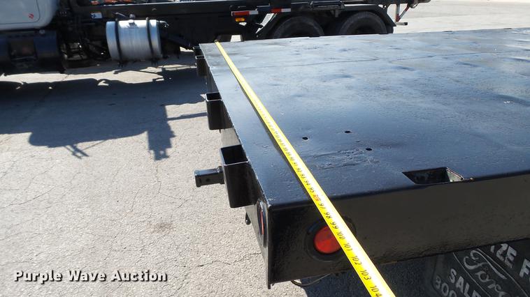image for item DD7399 2005 Ford F550 Super Duty XL Crew Cab flatbed truck