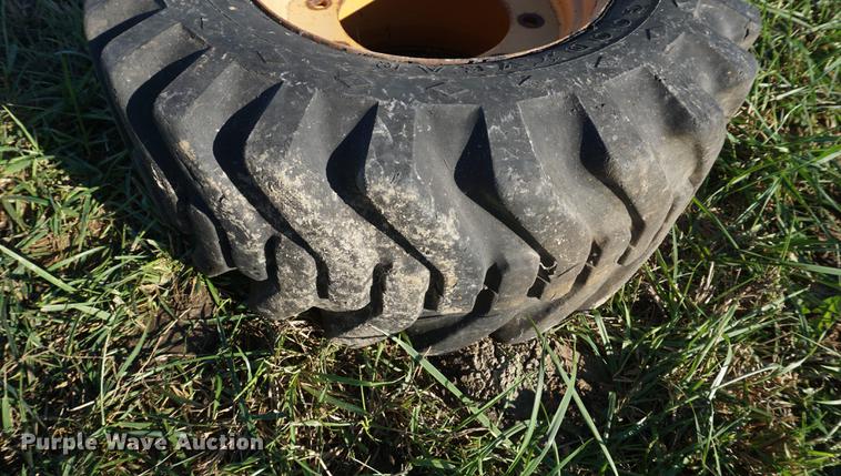 image for item EU9132 Goodyear 12-16.5 tires and wheel