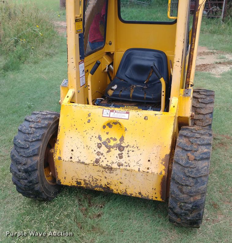 image for item G1348 1987 John Deere 575 skid steer
