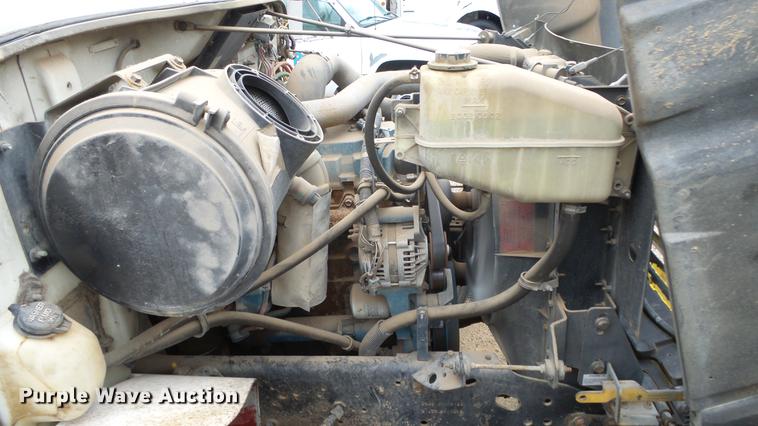 image for item AM9051 1999 International 4900 refuse truck