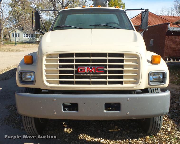 image for item DE7318 1997 GMC C7500 flatbed truck with fish transporter