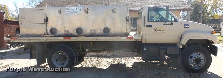 image for item DE7318 1997 GMC C7500 flatbed truck with fish transporter