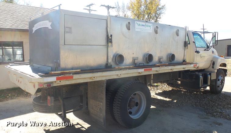image for item DE7318 1997 GMC C7500 flatbed truck with fish transporter