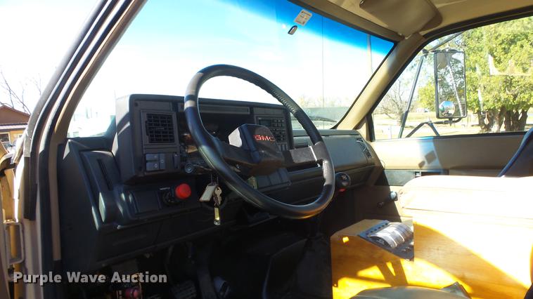 image for item DE7318 1997 GMC C7500 flatbed truck with fish transporter