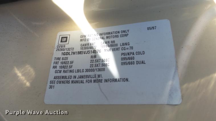 image for item DE7318 1997 GMC C7500 flatbed truck with fish transporter