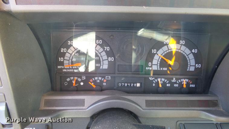 image for item DE7318 1997 GMC C7500 flatbed truck with fish transporter