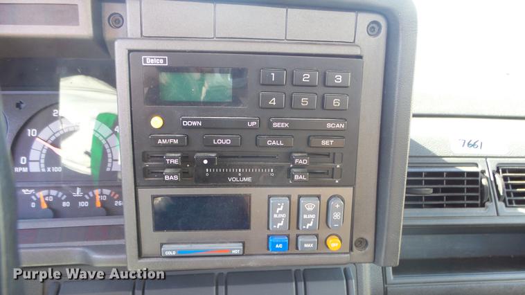 image for item DE7318 1997 GMC C7500 flatbed truck with fish transporter