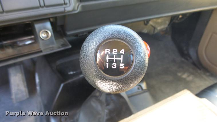 image for item DE7318 1997 GMC C7500 flatbed truck with fish transporter