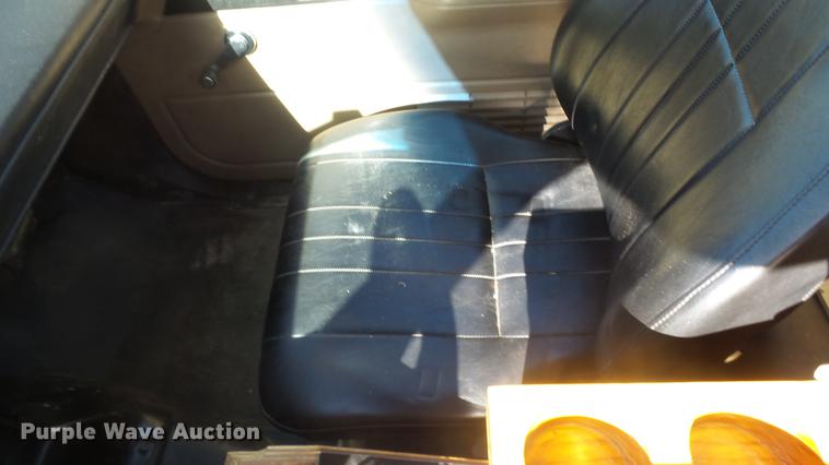 image for item DE7318 1997 GMC C7500 flatbed truck with fish transporter