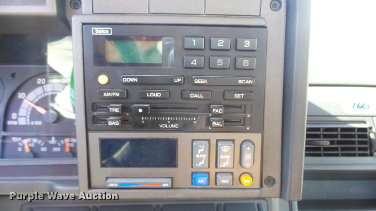 image for item DE7318 1997 GMC C7500 flatbed truck with fish transporter