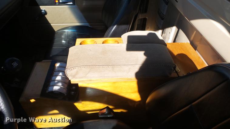 image for item DE7318 1997 GMC C7500 flatbed truck with fish transporter