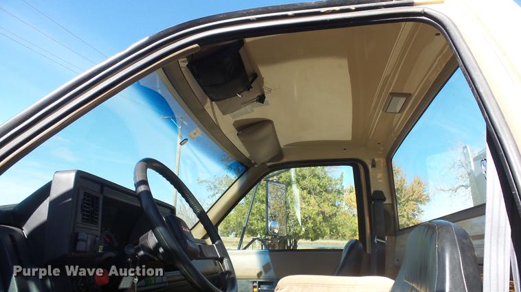 image for item DE7318 1997 GMC C7500 flatbed truck with fish transporter