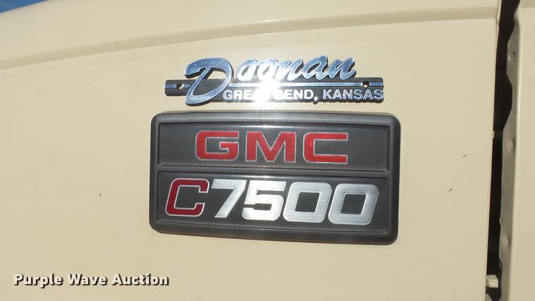 image for item DE7318 1997 GMC C7500 flatbed truck with fish transporter