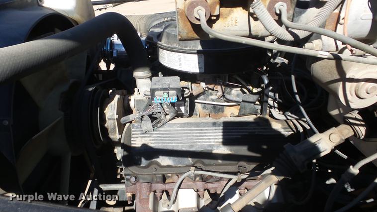 image for item DE7318 1997 GMC C7500 flatbed truck with fish transporter