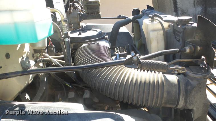 image for item DE7318 1997 GMC C7500 flatbed truck with fish transporter