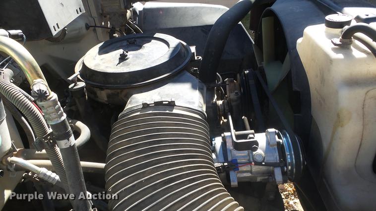 image for item DE7318 1997 GMC C7500 flatbed truck with fish transporter