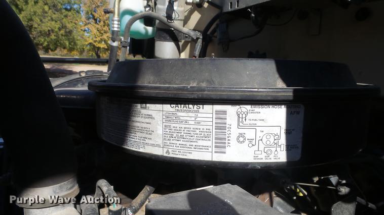 image for item DE7318 1997 GMC C7500 flatbed truck with fish transporter