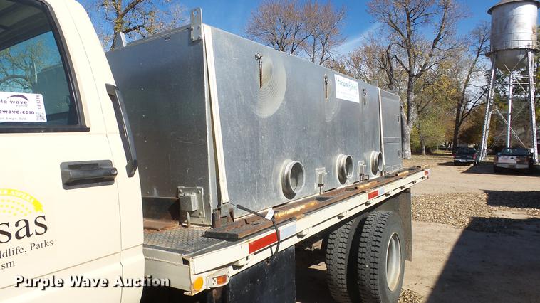 image for item DE7318 1997 GMC C7500 flatbed truck with fish transporter