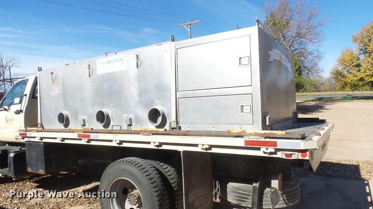 image for item DE7318 1997 GMC C7500 flatbed truck with fish transporter