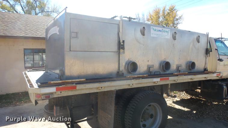 image for item DE7318 1997 GMC C7500 flatbed truck with fish transporter