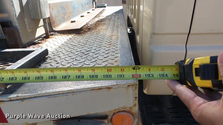 image for item DE7318 1997 GMC C7500 flatbed truck with fish transporter