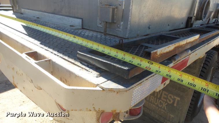 image for item DE7318 1997 GMC C7500 flatbed truck with fish transporter