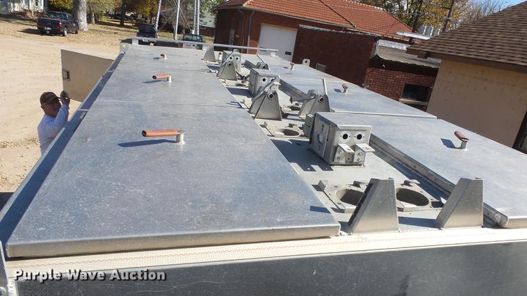 image for item DE7318 1997 GMC C7500 flatbed truck with fish transporter