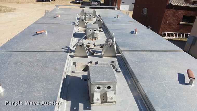 image for item DE7318 1997 GMC C7500 flatbed truck with fish transporter