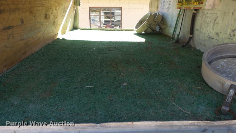 image for item DE7318 1997 GMC C7500 flatbed truck with fish transporter