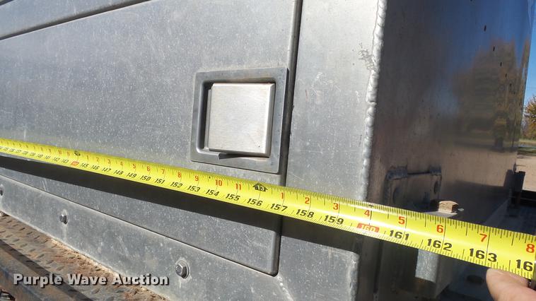 image for item DE7318 1997 GMC C7500 flatbed truck with fish transporter