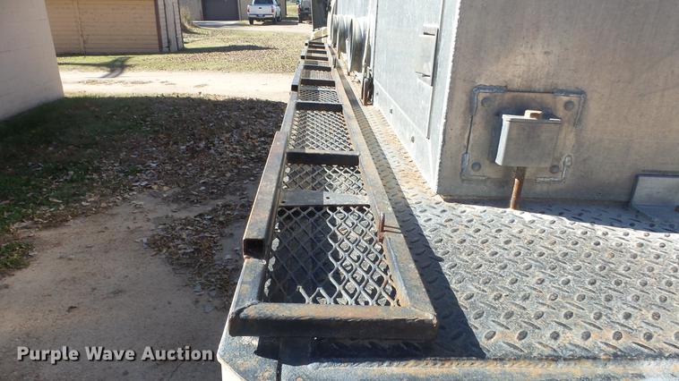 image for item DE7318 1997 GMC C7500 flatbed truck with fish transporter