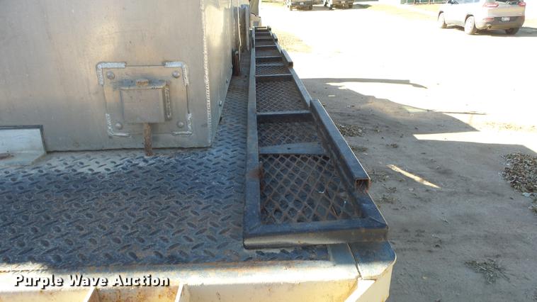 image for item DE7318 1997 GMC C7500 flatbed truck with fish transporter