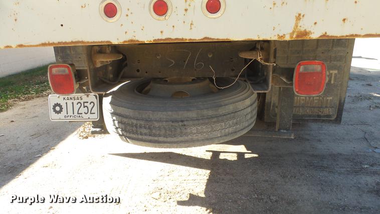 image for item DE7318 1997 GMC C7500 flatbed truck with fish transporter