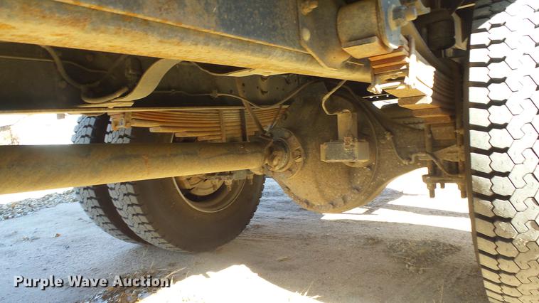 image for item DE7318 1997 GMC C7500 flatbed truck with fish transporter