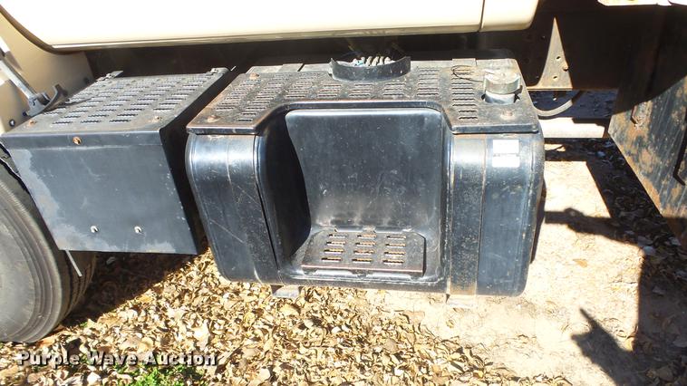 image for item DE7318 1997 GMC C7500 flatbed truck with fish transporter