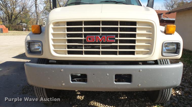 image for item DE7318 1997 GMC C7500 flatbed truck with fish transporter