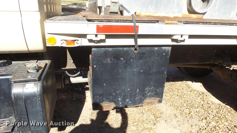 image for item DE7318 1997 GMC C7500 flatbed truck with fish transporter