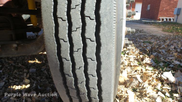 image for item DE7318 1997 GMC C7500 flatbed truck with fish transporter