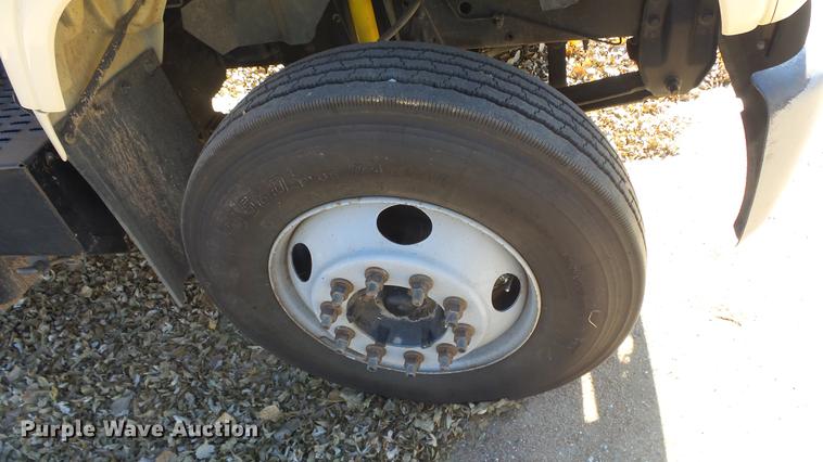 image for item DE7318 1997 GMC C7500 flatbed truck with fish transporter