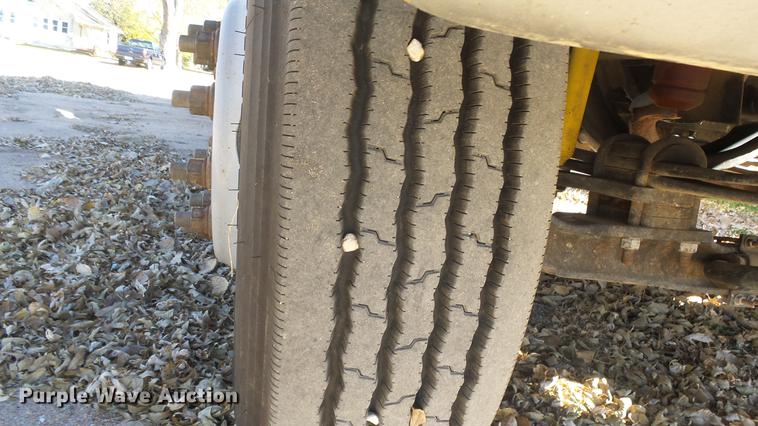 image for item DE7318 1997 GMC C7500 flatbed truck with fish transporter