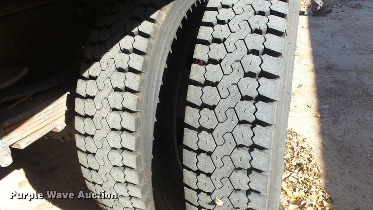 image for item DE7318 1997 GMC C7500 flatbed truck with fish transporter