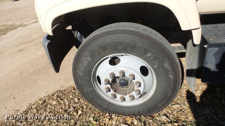 image for item DE7318 1997 GMC C7500 flatbed truck with fish transporter