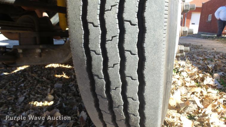 image for item DE7318 1997 GMC C7500 flatbed truck with fish transporter