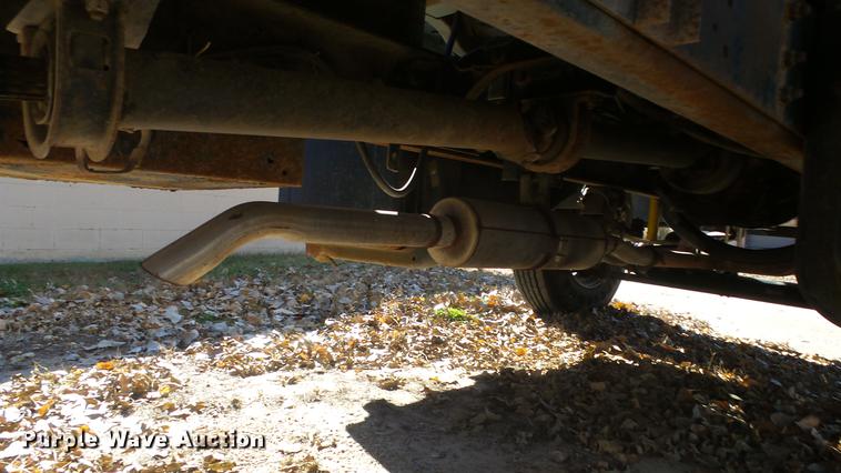 image for item DE7318 1997 GMC C7500 flatbed truck with fish transporter