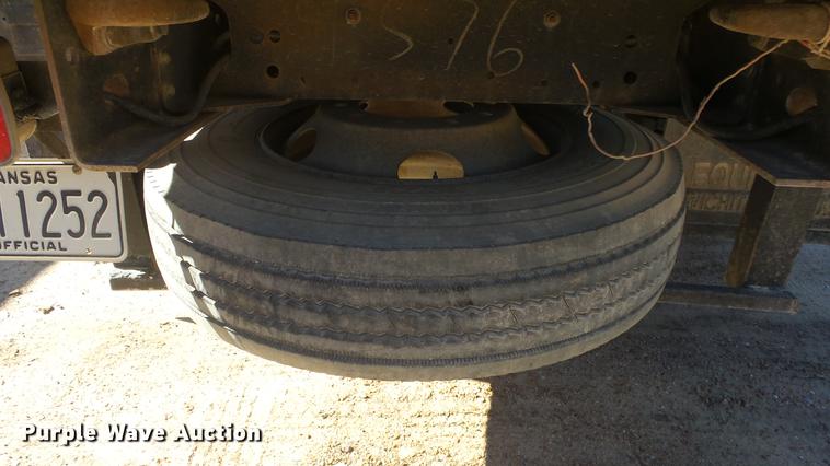 image for item DE7318 1997 GMC C7500 flatbed truck with fish transporter