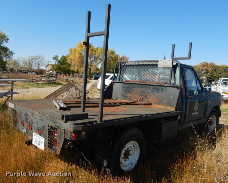 image for item DF1929 1984 Ford F250 flatbed pickup truck